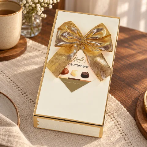 Food & Drink — Hamlet cream gift box of assorted chocolates in a natural editorial setting